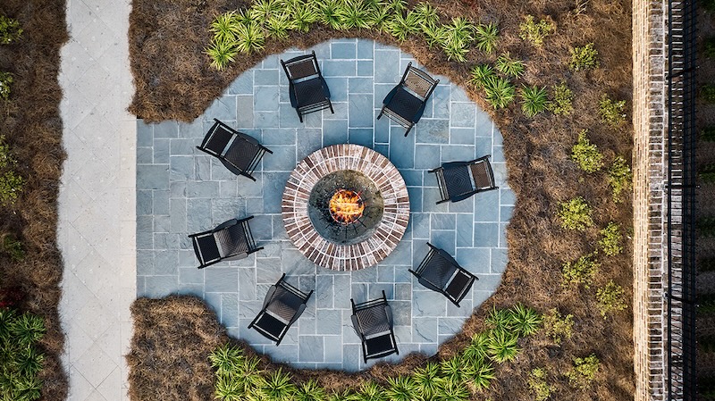 Aerial view of a circle fire pit with blue pavers