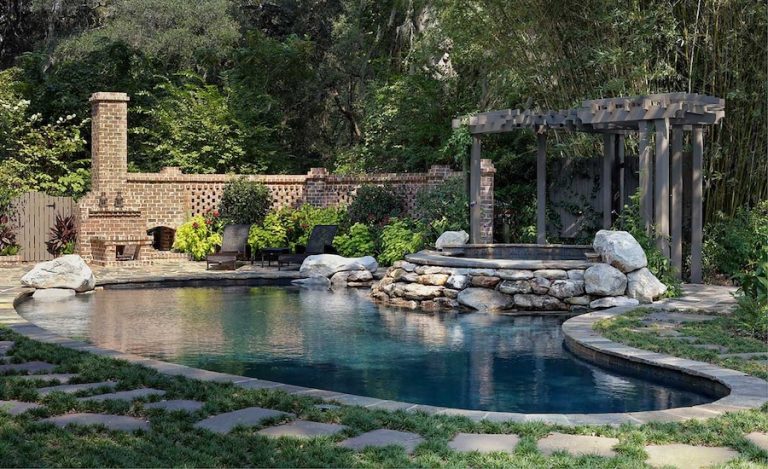 Outdoor Landscaping with pool, fireplace and greenery - Savannah Hardscapes