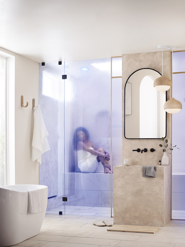 Woman in steam shower for luxury home bathrooms and wellness