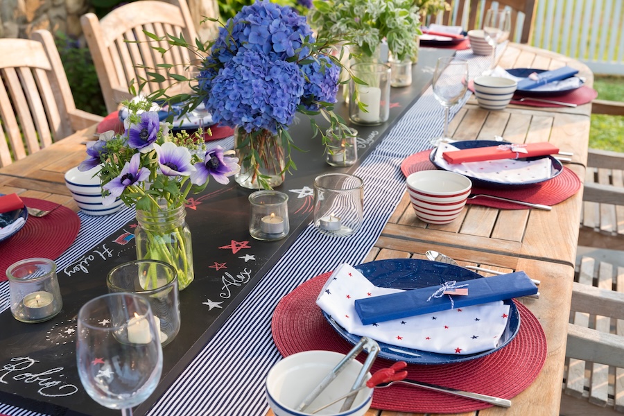 Outdoor dining table set for a summer backyard barbecue gathering