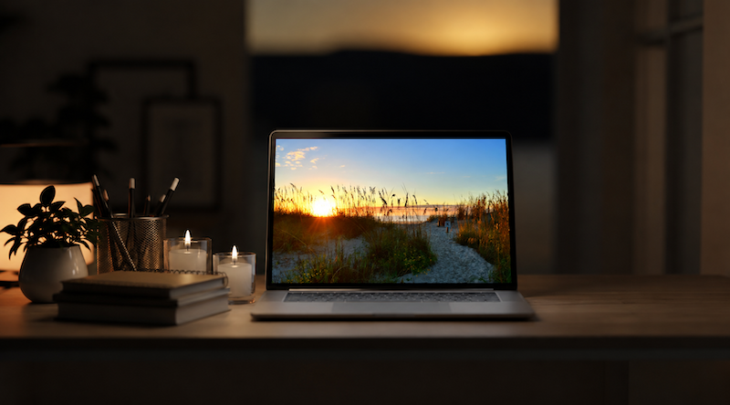 Laptop displaying a guided meditation session in a quiet room