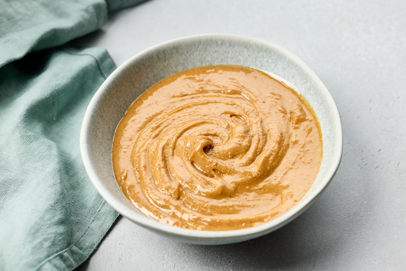 Bowl of creamy homemade peanut sauce