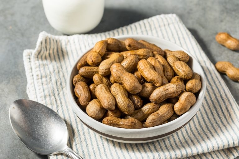 Bowl of homemade boiled peanuts on kitchen towel