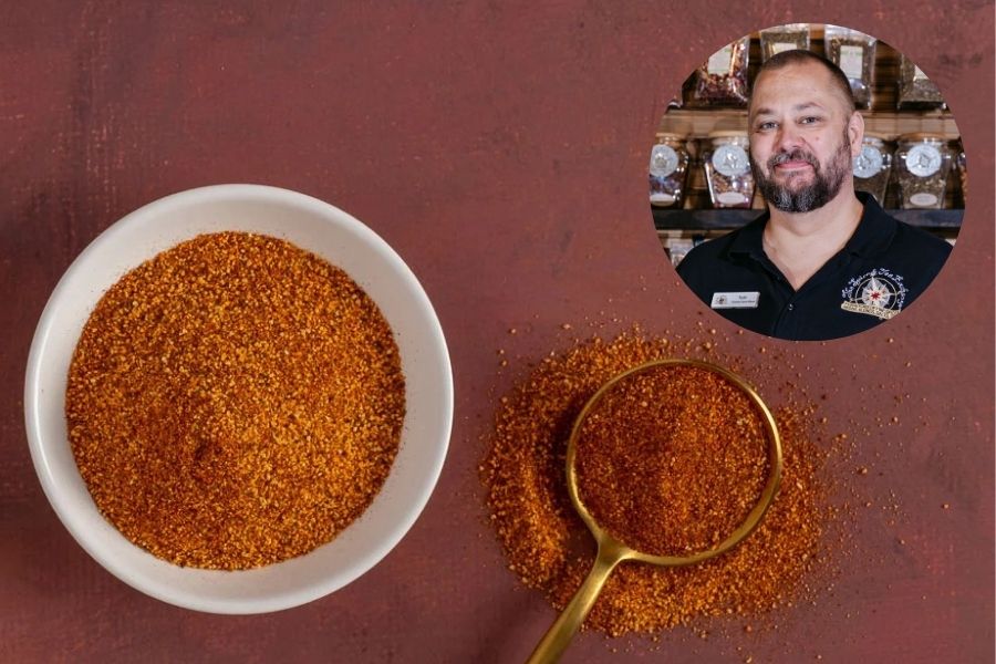 Todd Ernst of The Spice & Tea Exchange holding Honey BBQ Rub seasoning