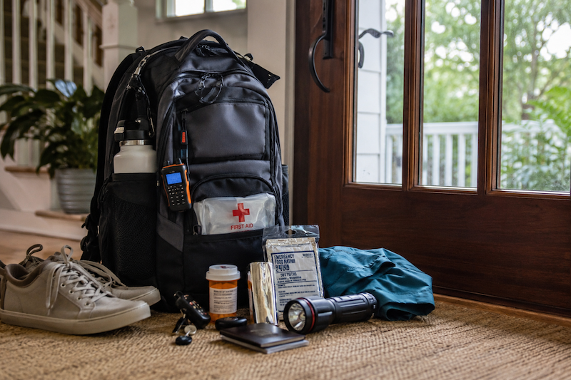 Emergency evacuation bag packed with hurricane preparedness supplies