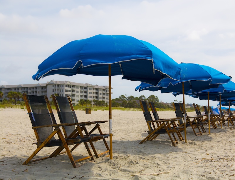 Beach umbrellas providing shade during extreme Lowcountry summer heat