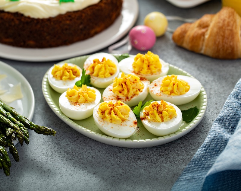 Platter of homemade deviled eggs topped with paprika