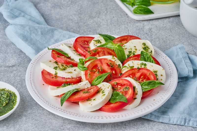 Fresh caprese salad with tomatoes mozzarella and basil