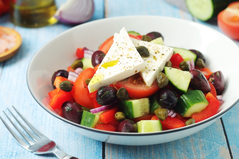 Traditional Greek salad with tomatoes cucumbers feta and Kalamata olives
