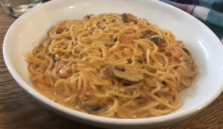 Bowl of creamy vermicelli pasta topped with Charlie Drawdy's signature sauce