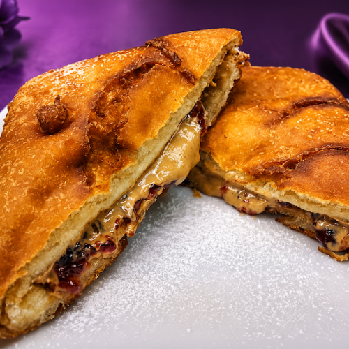 Golden fried peanut butter and jelly sandwich dusted with powdered sugar from The Purple Cow.