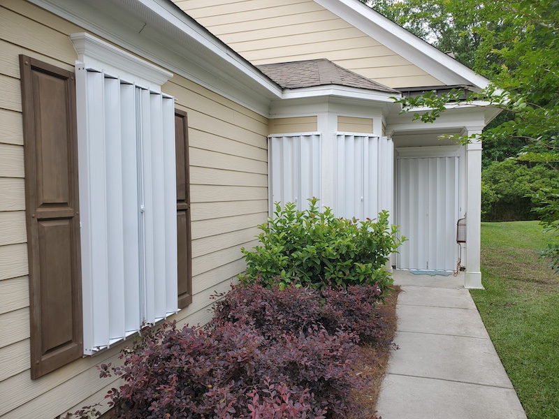 Accordion shutters hurricane window treatment protection