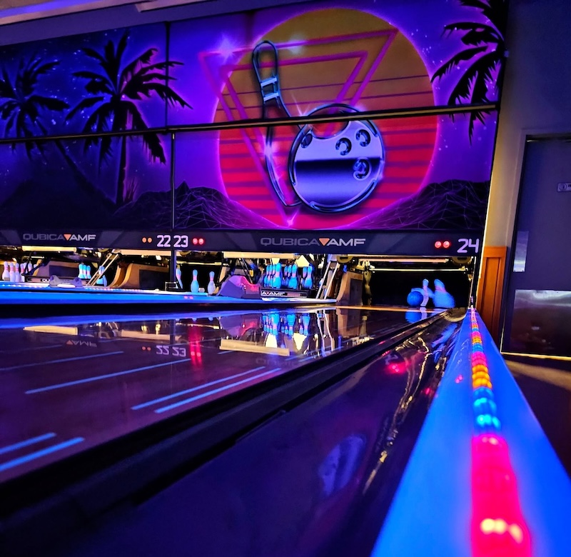 Friends enjoying bowling and arcade games at Station 300 on Hilton Head Island.