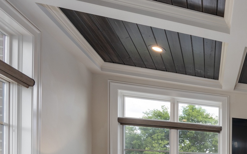 Game room paint palette dark ceiling white trim close-up