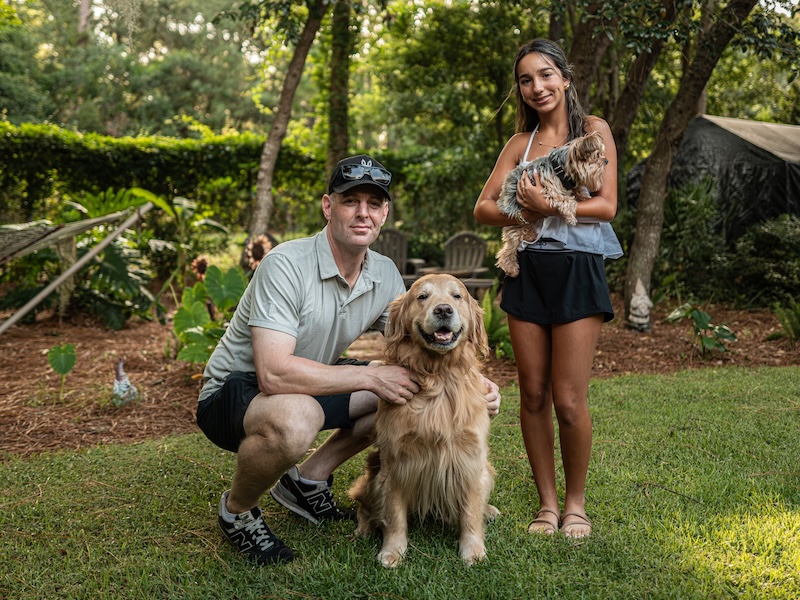 Professional dog trainer Drew Kaufman with Bear, Coco and daughter Katelyn Kaufman in Beaufort County.
