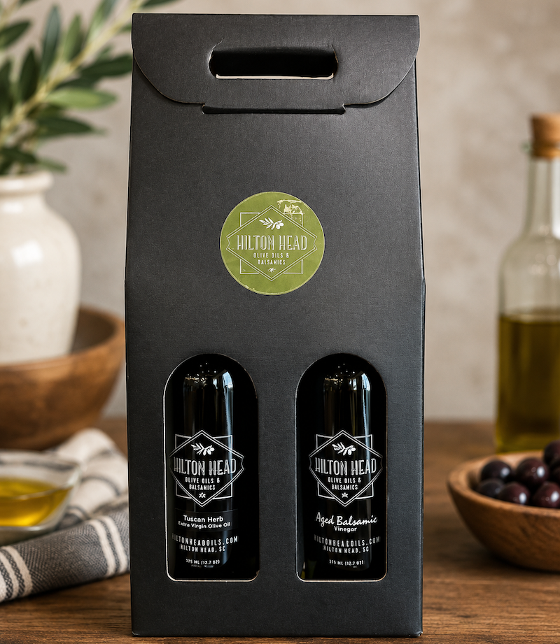 Extra-virgin olive oil and aged balsamic vinegar from Hilton Head Olive Oils & Balsamics displayed together.