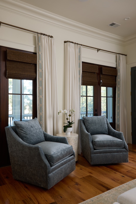Palmetto Bluff home by Front Light Building Company and Iris and Oak Interiors living room arm chairs
