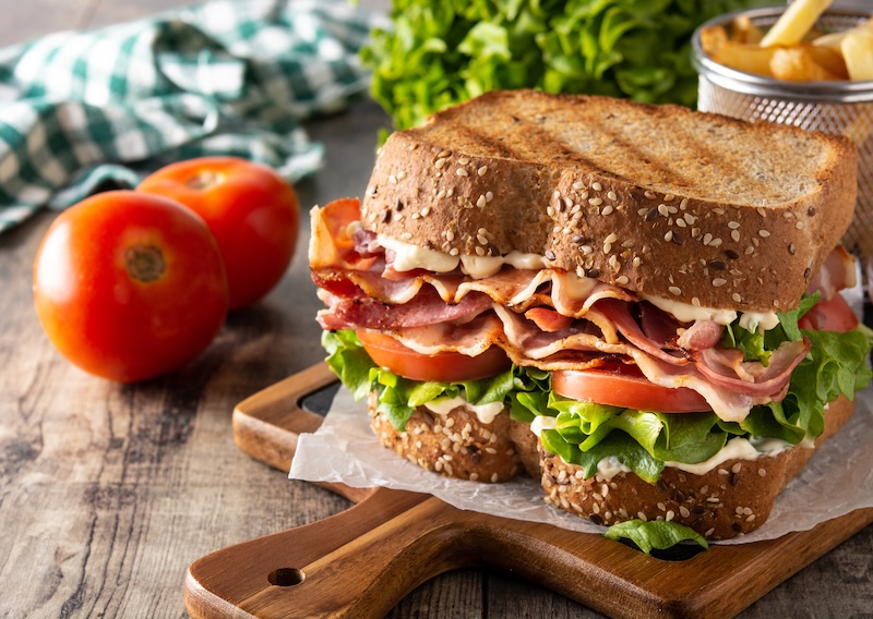 BLT sandwich with bacon,lettuce and tomato on wooden table