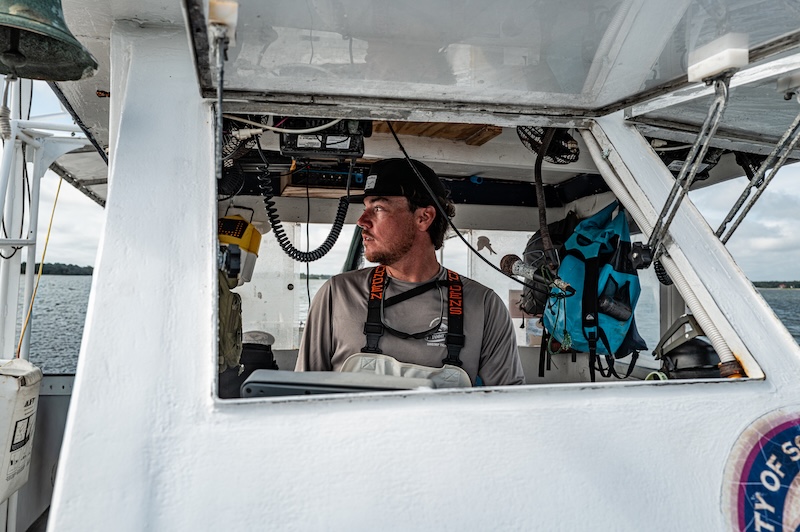 Hilton Head Island native Ian Deery at the helm of the Tammy Jane shrimp trawler.