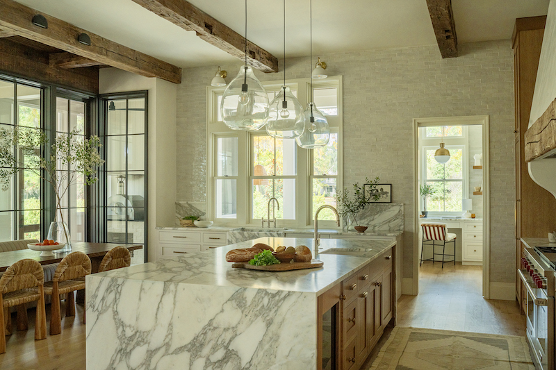 Award-winning kitchen with rustic masonry by Court Atkins Group in Palmetto Bluff