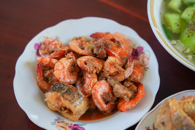 Shrimp finished in a gently simmering tomato-based sauce to absorb flavor without overcooking.