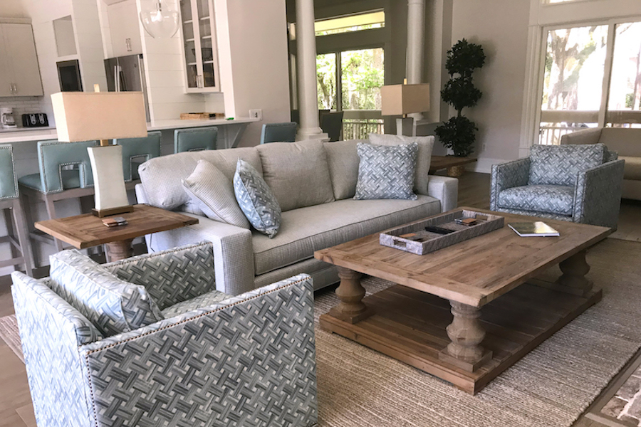 Home designed for functionality with arm chairs and couch