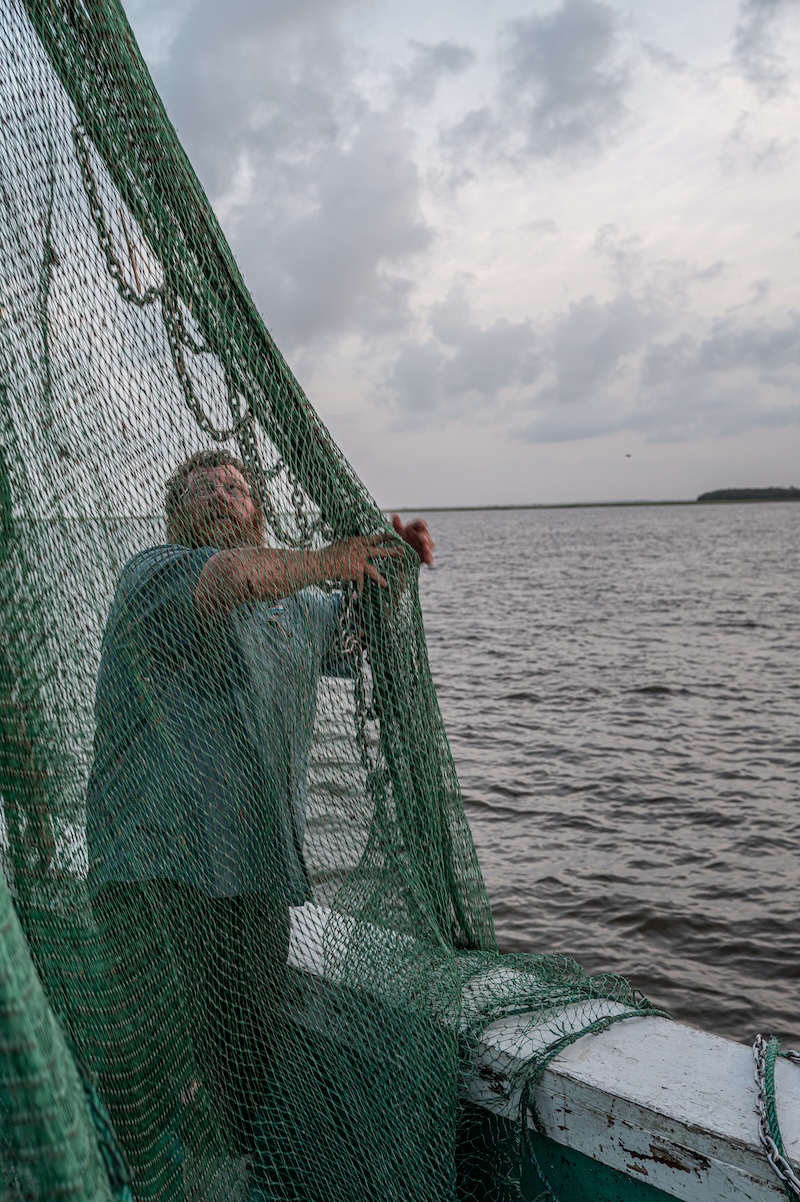 Commercial shrimping nets being lowered into the Atlantic from the Gracie Belle.