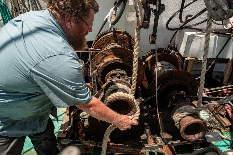Reeling in a shrimp trawl bag
