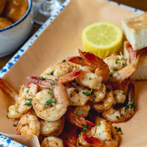 Quarterdeck’s local charcoal-roasted shrimp with garlic butter, fresh herbs and toasted challah bread.
