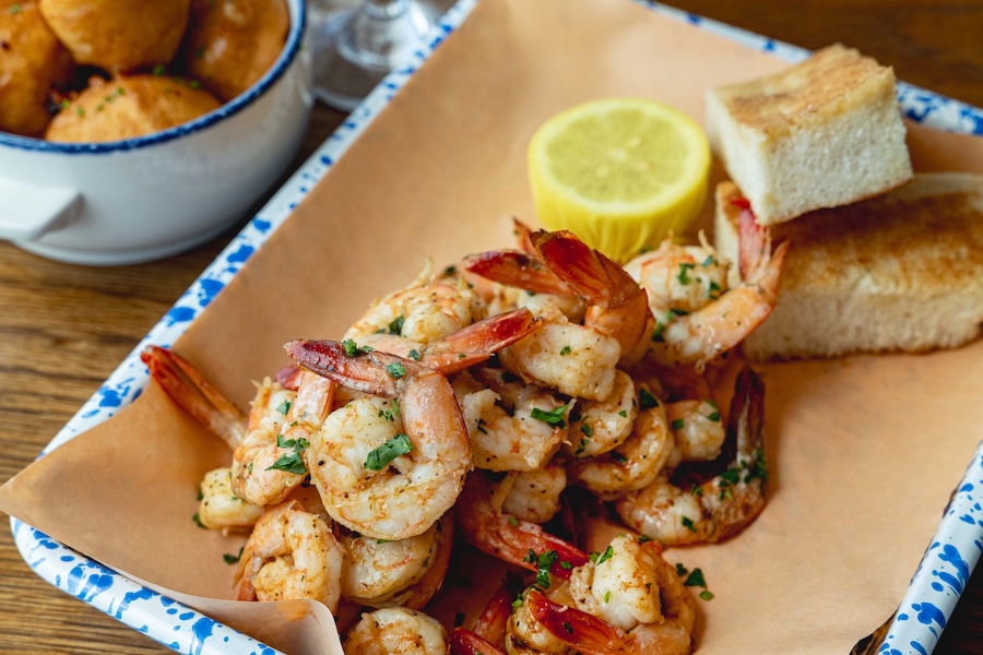 Quarterdeck’s local charcoal-roasted shrimp with garlic butter, fresh herbs and toasted challah bread.