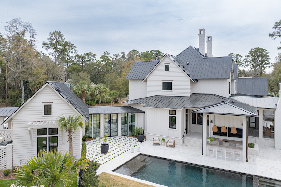 Palmetto Bluff backyard with pool and outdoor kitchen space by Court Atkins Group and photgraphy by Kelli Boyd
