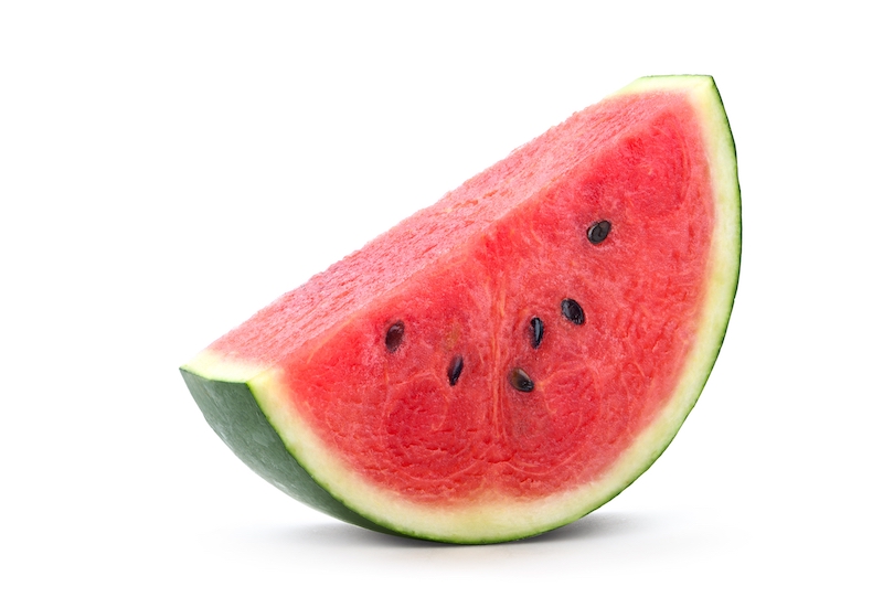 Watermelon slice with black seeds