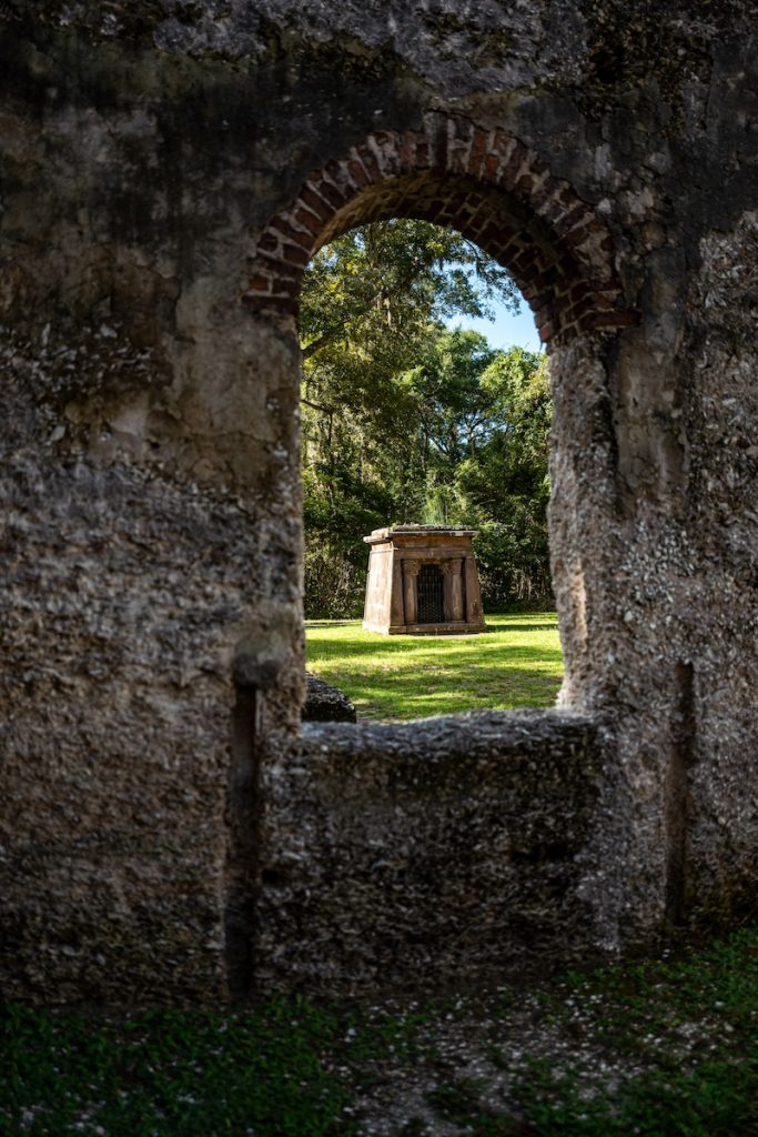 Fripp mausoleum seen through a window in the tabby ruins of the Chapel of Ease