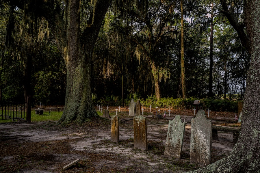 Weathered headstones beneath live oaks at Zion Cemetery on Hilton Head Island