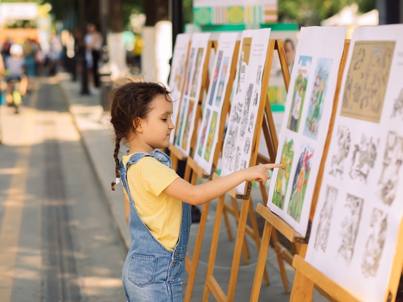 Kid looking at artwork