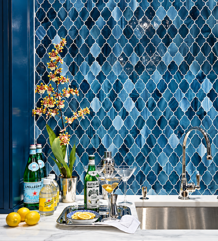 Blue mosaic tile backsplash with a diamond pattern behind a countertop