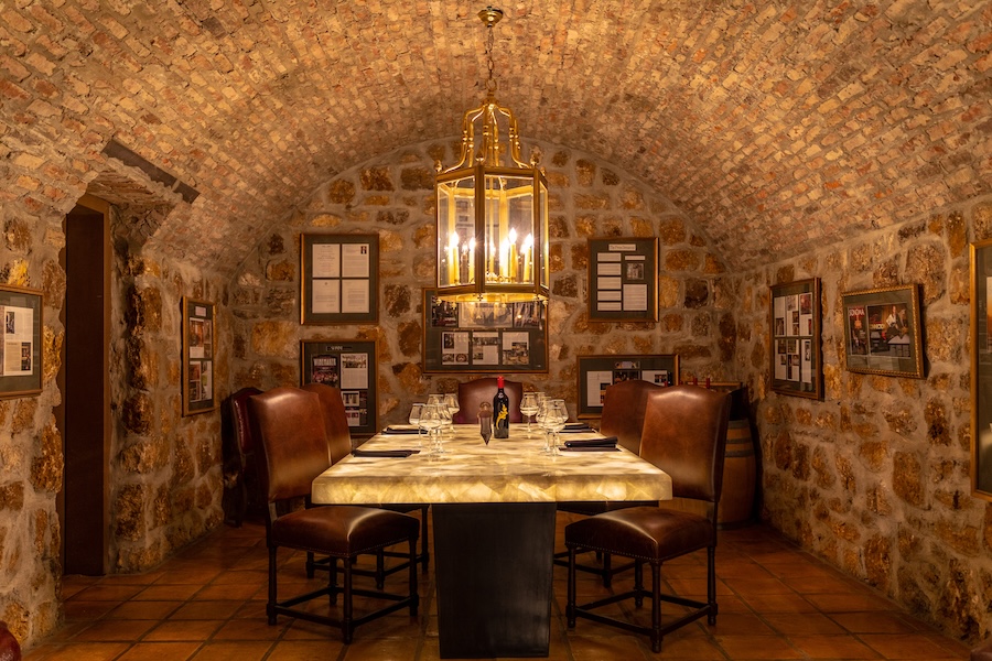 Private tasting room with stone walls and a barrel-vaulted ceiling beneath Buena Vista Winery in Sonoma