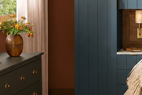 Close-up of cozy bedroom with burnished orange walls, deep blue floor-to-ceiling millwork, cream bedding and natural wood accents