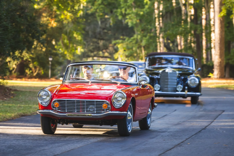 Classic cars traveling through Hilton Head Island during the Lowcountry Driving Tour