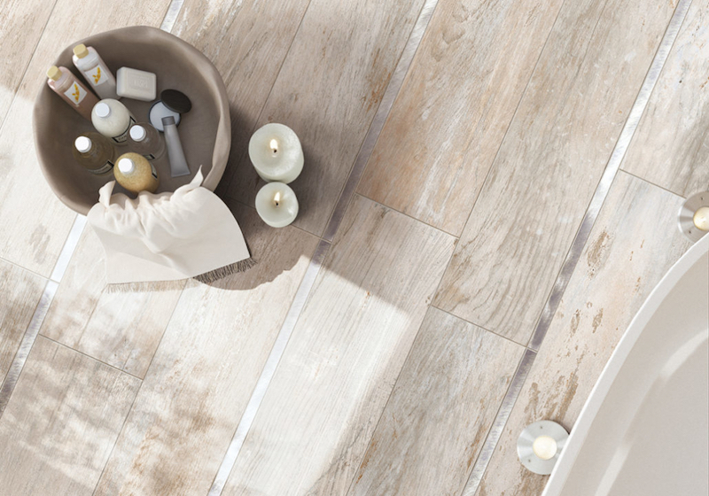 Wood-look tile flooring with variations in warm neutral tones and grain