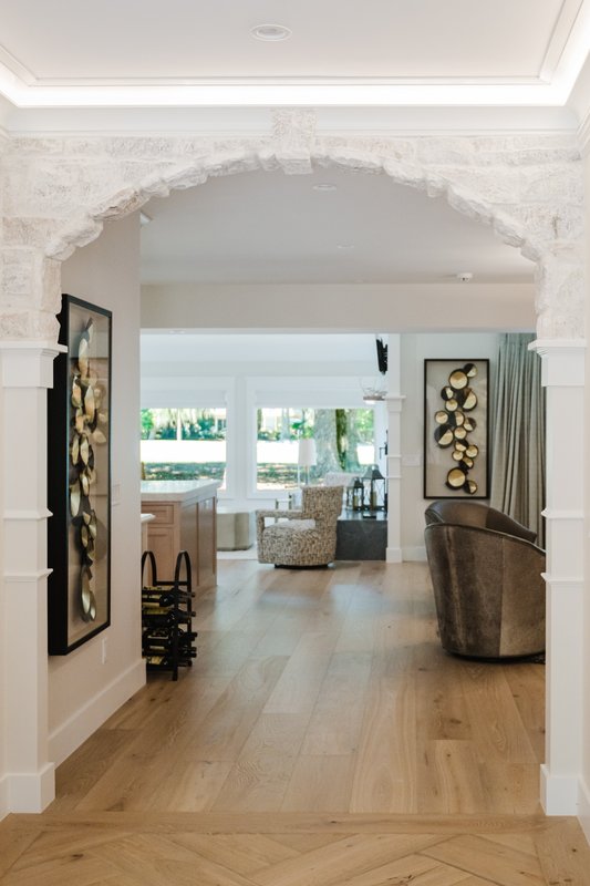Limestone archway connecting interior rooms in a renovated Sea Pines home