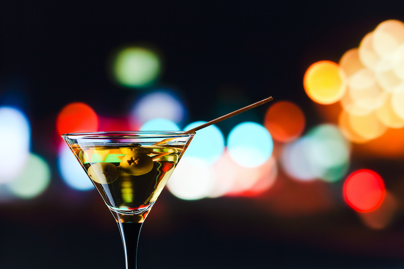 Cocktail glass with olive garnish 