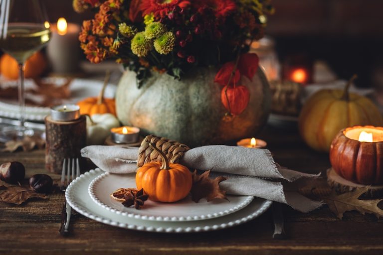 Festive fall holiday dinner party decorations on table