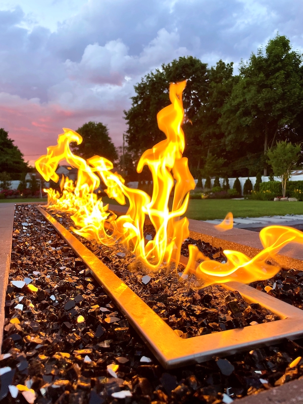 Flames rising from an outdoor fire feature