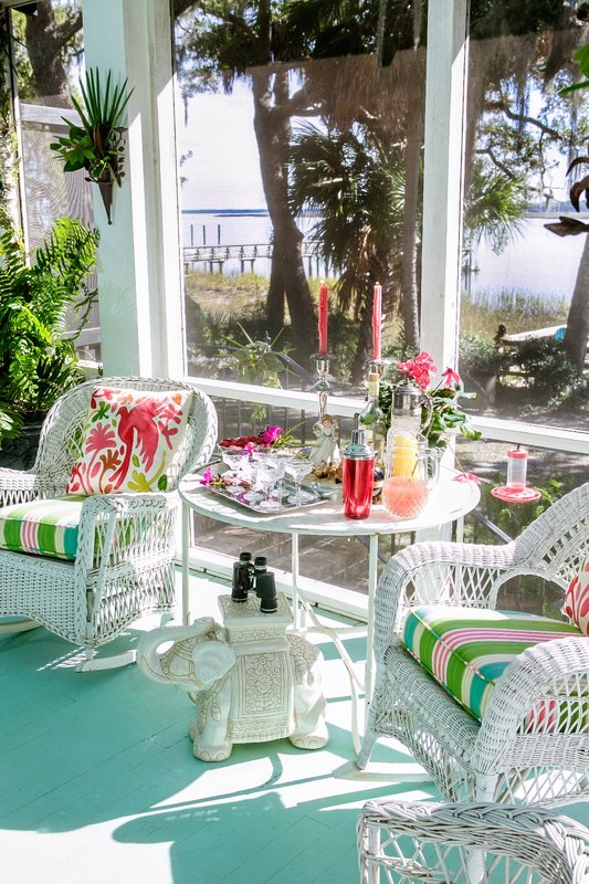 Colorful outdoor seating and table arrangements at a Bluffton home