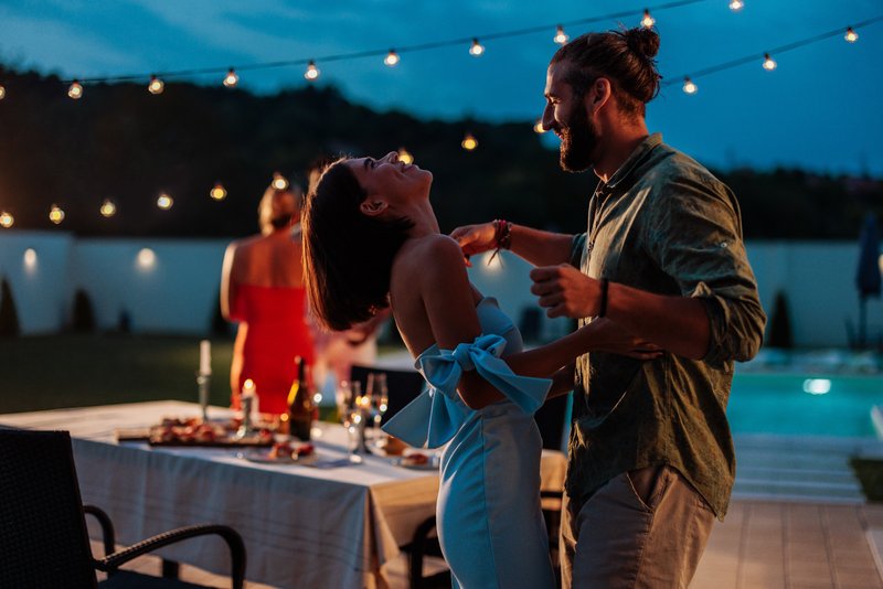 Couple dancing at outdoor party